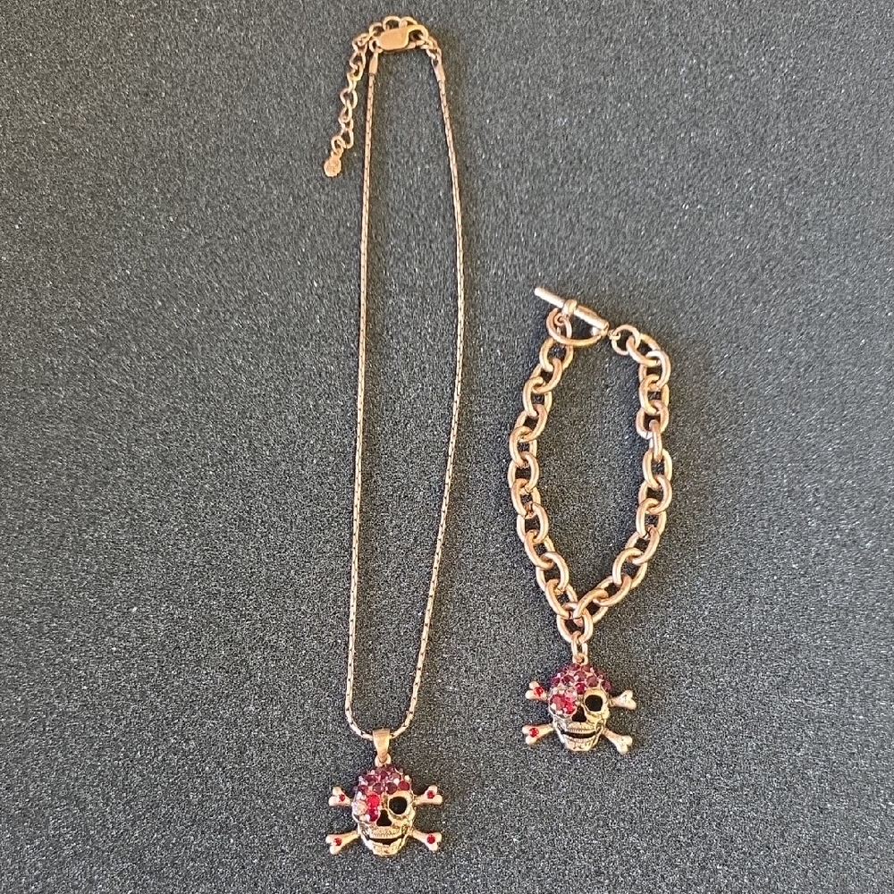 Rose Gold Skull & Crossbones Necklace and Bracelet Set with Red‎ Accents